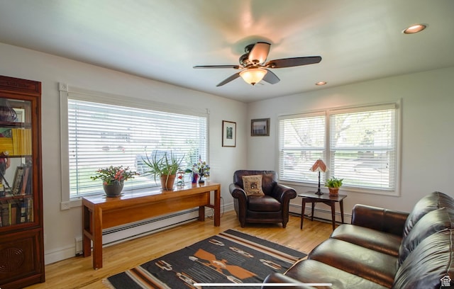 331 W Elberta Dr, Pleasant View, UT 84414 - living room featuring a baseboard heating unit, plenty of natural light, a ceiling fan, and recessed lighting