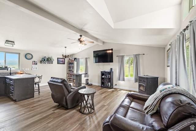1665 E 1280 N, Mount Pleasant, UT 84647 - living room with a wood stove, light wood finished floors, ceiling fan, and baseboards