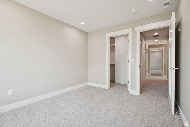 953 W 125 S, Lehi, UT 84043 - unfurnished bedroom featuring light colored carpet, a walk in closet, and recessed lighting