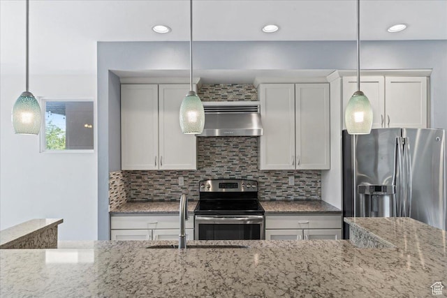 4746 W S Jordan Pkwy, South Jordan, UT 84009 - kitchen with stainless steel appliances, extractor fan, a sink, light stone counters, and tasteful backsplash