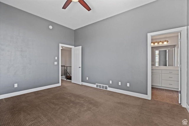 4746 W S Jordan Pkwy, South Jordan, UT 84009 - unfurnished bedroom with carpet, baseboards, a ceiling fan, and connected bathroom