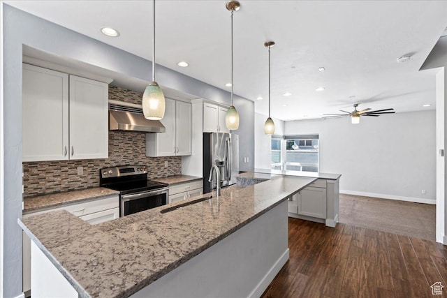 4746 W S Jordan Pkwy, South Jordan, UT 84009 - kitchen featuring stainless steel appliances, extractor fan, a center island with sink, ceiling fan, and dark wood-style floors