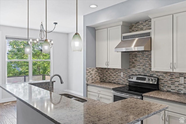 4746 W S Jordan Pkwy, South Jordan, UT 84009 - kitchen featuring wall chimney range hood, a sink, stainless steel electric range oven, light stone countertops, and tasteful backsplash