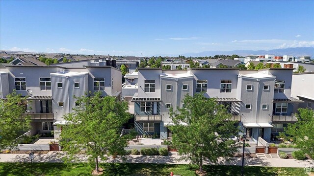 4746 W S Jordan Pkwy, South Jordan, UT 84009 - view of building exterior with a residential view and a mountain view