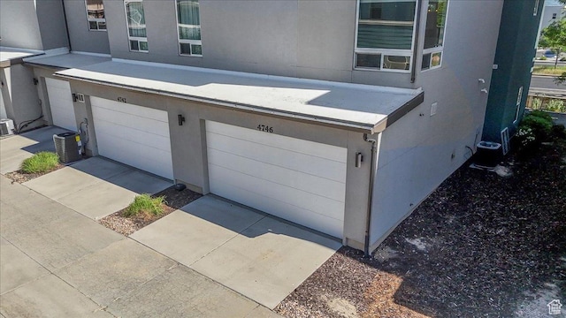 4746 W S Jordan Pkwy, South Jordan, UT 84009 - garage with central air condition unit and driveway