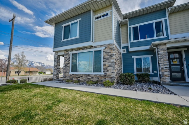 1712 W Naxos Ln, South Jordan, UT 84095 - view of front facade with stone siding and a mountain view