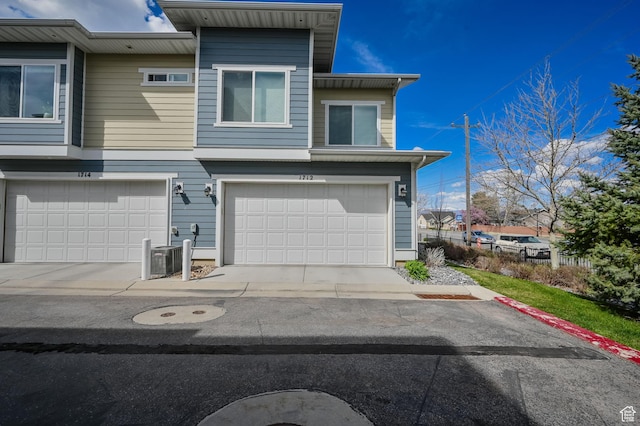 1712 W Naxos Ln, South Jordan, UT 84095 - view of front of home with an attached garage and central air condition unit