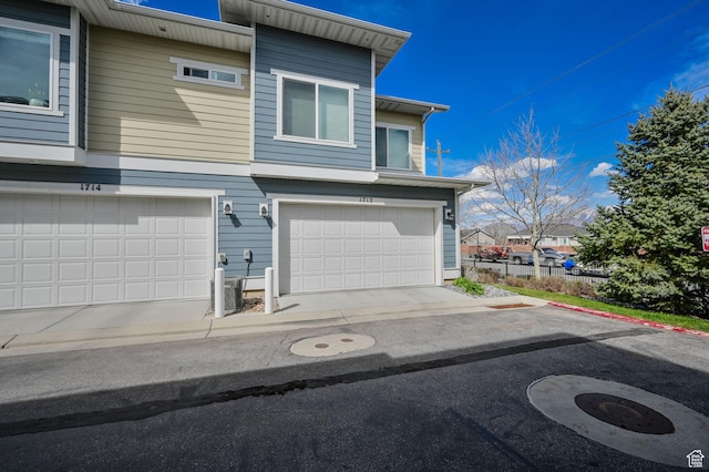 1712 W Naxos Ln, South Jordan, UT 84095 - view of front of house featuring central AC unit and an attached garage