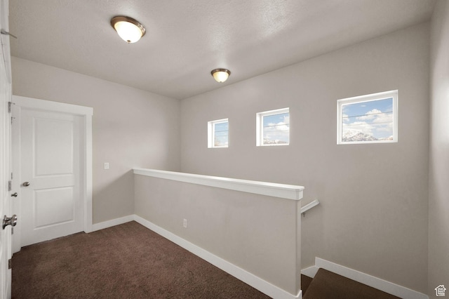 1712 W Naxos Ln, South Jordan, UT 84095 - spare room featuring dark colored carpet and baseboards