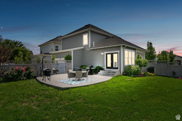 5206 W Mellow Way S, South Jordan, UT 84009 - back of property at dusk with entry steps, french doors, a patio area, and a gate
