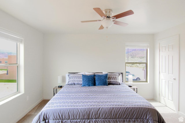 3853 S Red Valley Cir S Unit 23-A4, Moab, UT 84532 - carpeted bedroom with multiple windows, ceiling fan, and baseboards