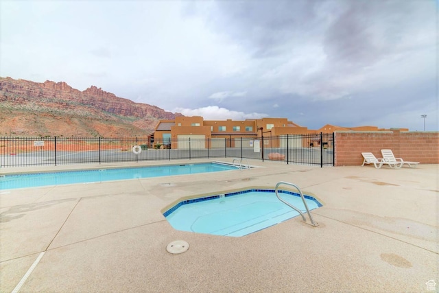 3853 S Red Valley Cir S Unit 23-A4, Moab, UT 84532 - community pool with a mountain view and a patio