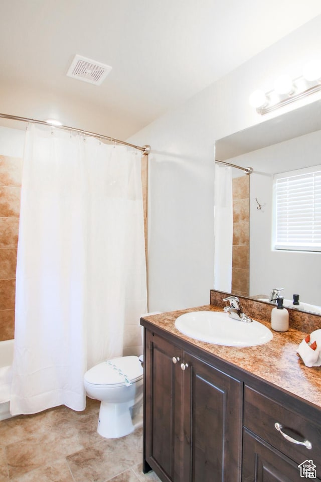 3853 S Red Valley Cir S Unit 23-A4, Moab, UT 84532 - bathroom featuring vanity, toilet, and shower / tub combo with curtain