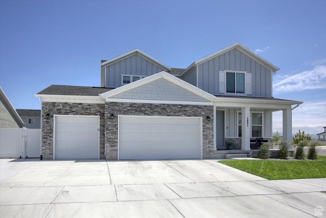 2895 S 2900 W, Syracuse, UT 84075 - craftsman inspired home with a porch, an attached garage, driveway, and board and batten siding