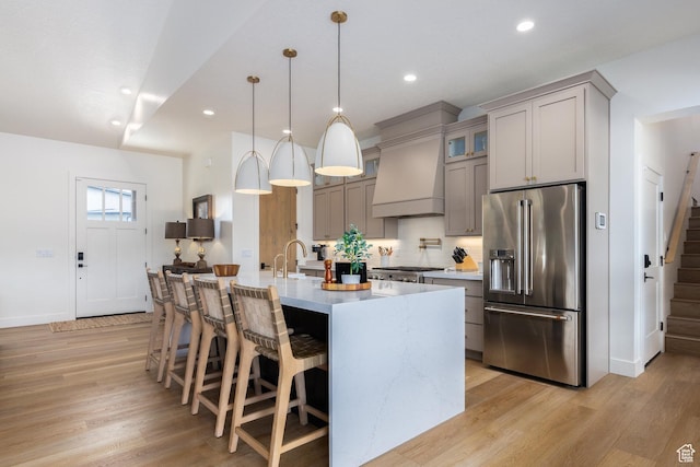 985 Hart Loop, Kamas, UT 84036 - kitchen with high end refrigerator, light countertops, backsplash, light wood finished floors, and recessed lighting