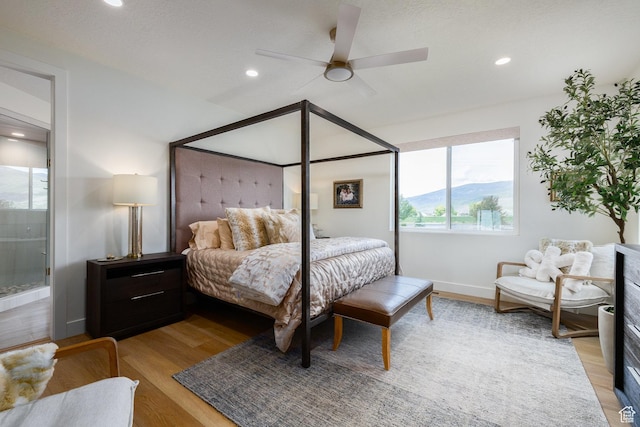 985 Hart Loop, Kamas, UT 84036 - bedroom featuring light wood finished floors, recessed lighting, a ceiling fan, ensuite bath, and baseboards