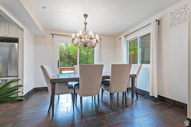 2300 Comstock Dr, Park City, UT 84060 - dining area featuring a chandelier, healthy amount of natural light, and baseboards