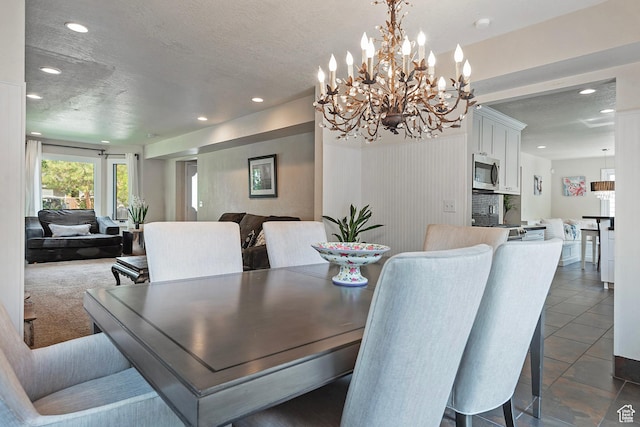 2300 Comstock Dr, Park City, UT 84060 - dining area with recessed lighting, a chandelier, a textured ceiling, and dark tile patterned floors