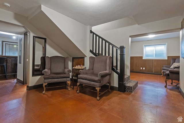 2300 Comstock Dr, Park City, UT 84060 - sitting room featuring wainscoting, stairway, and wooden walls