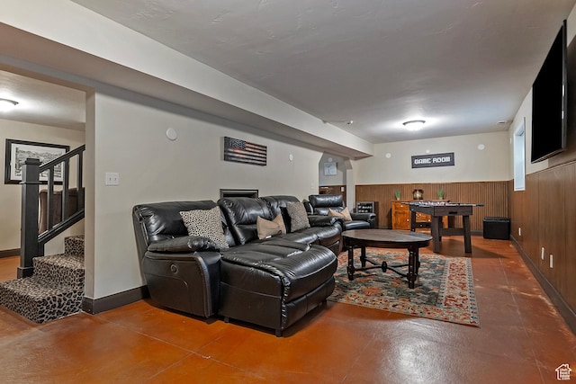2300 Comstock Dr, Park City, UT 84060 - living area with concrete flooring, stairway, wainscoting, and wooden walls
