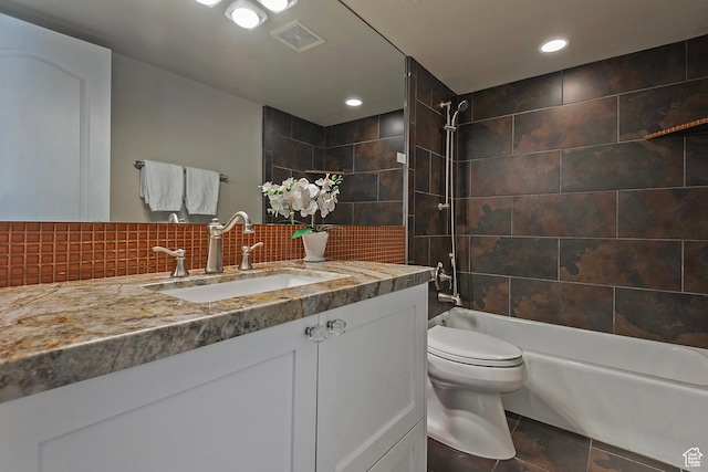 2300 Comstock Dr, Park City, UT 84060 - bathroom featuring vanity, washtub / shower combination, toilet, decorative backsplash, and recessed lighting