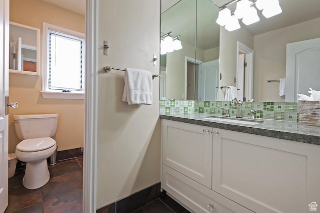 2300 Comstock Dr, Park City, UT 84060 - bathroom with tasteful backsplash, vanity, toilet, baseboards, and tile patterned flooring