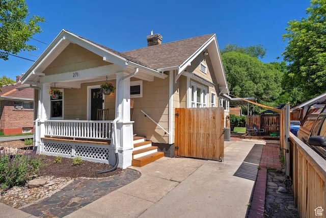 271 E Kensington Ave S, Salt Lake City, UT 84115 - view of front facade with covered porch, roof with shingles, and a chimney