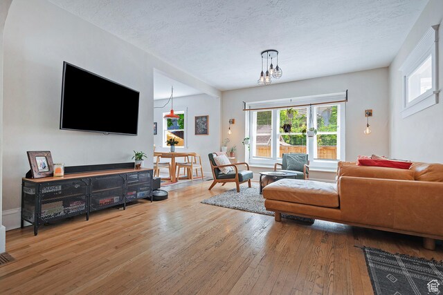 271 E Kensington Ave S, Salt Lake City, UT 84115 - living room featuring hardwood / wood-style floors, plenty of natural light, and a textured ceiling