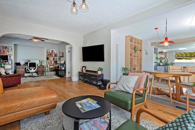 271 E Kensington Ave S, Salt Lake City, UT 84115 - living area featuring arched walkways, an office area, ceiling fan, and wood finished floors