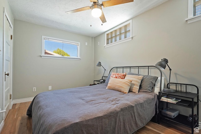 271 E Kensington Ave S, Salt Lake City, UT 84115 - bedroom featuring wood finished floors, a textured ceiling, baseboards, and a ceiling fan