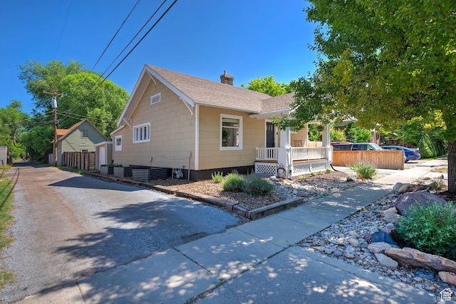 271 E Kensington Ave S, Salt Lake City, UT 84115 - bungalow-style home with a porch, a chimney, and a shingled roof