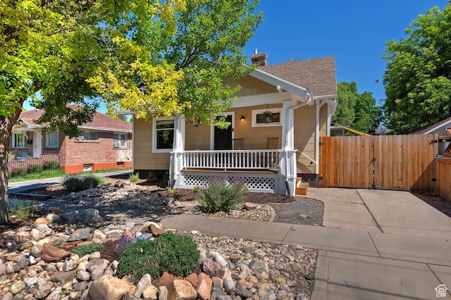 271 E Kensington Ave S, Salt Lake City, UT 84115 - view of front facade with a porch, a gate, a chimney, and a shingled roof