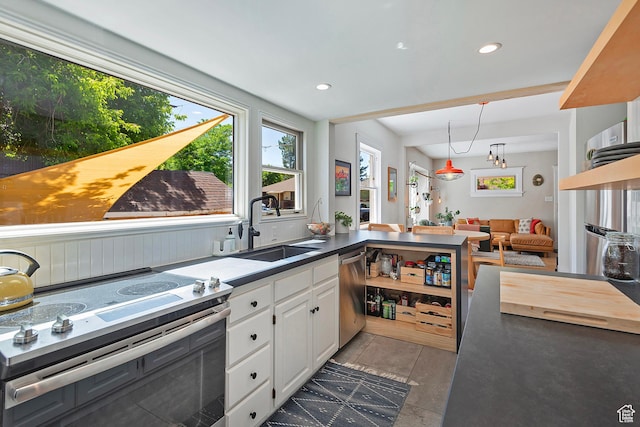 271 E Kensington Ave S, Salt Lake City, UT 84115 - kitchen with appliances with stainless steel finishes, a sink, white cabinetry, recessed lighting, and dark countertops
