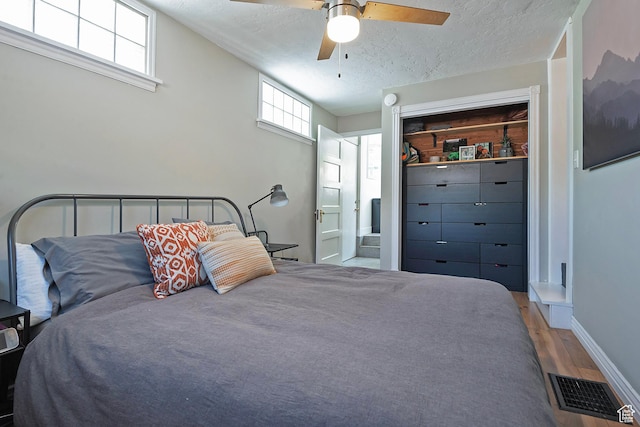271 E Kensington Ave S, Salt Lake City, UT 84115 - bedroom with wood finished floors, a textured ceiling, a ceiling fan, ensuite bath, and a closet