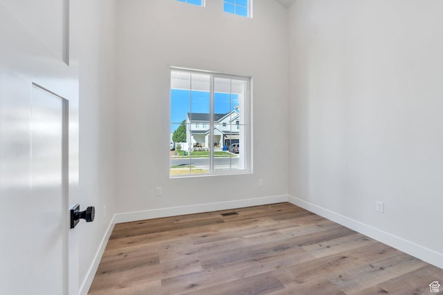 1601 S 3170 E, Spanish Fork, UT 84660 - spare room with plenty of natural light, wood finished floors, and a towering ceiling