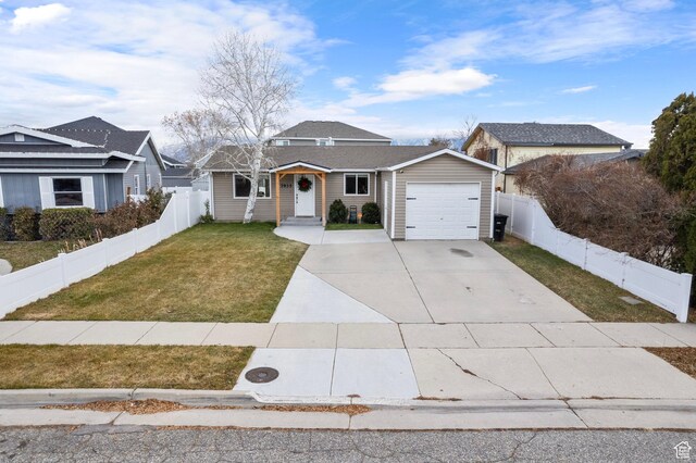 7935 S 2800 W, West Jordan, UT 84088 - view of front of home with an attached garage and concrete driveway