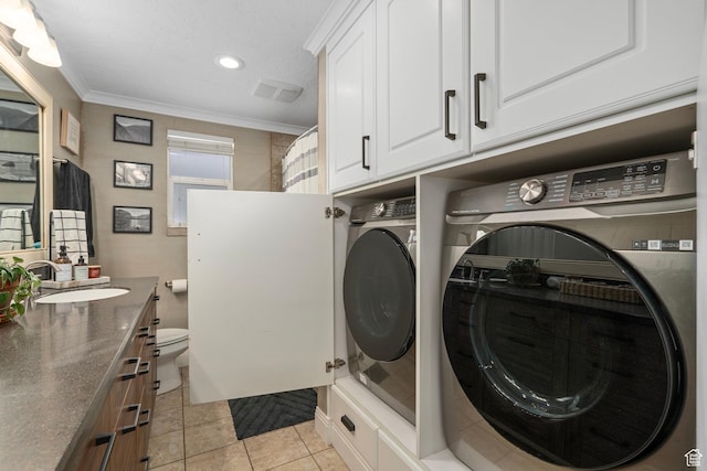 7935 S 2800 W, West Jordan, UT 84088 - washroom featuring washing machine and clothes dryer, ornamental molding, a sink, light tile patterned flooring, and recessed lighting