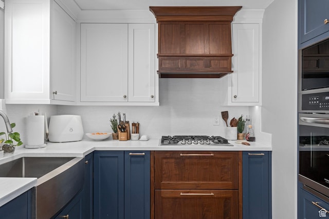 7935 S 2800 W, West Jordan, UT 84088 - kitchen featuring blue cabinetry, a sink, stainless steel appliances, and white cabinetry