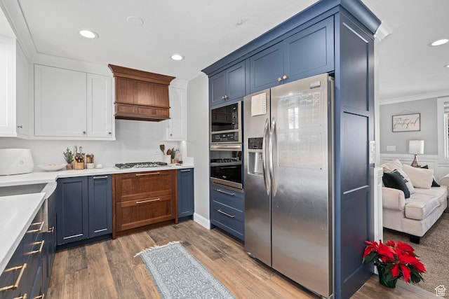 7935 S 2800 W, West Jordan, UT 84088 - kitchen featuring stainless steel appliances, crown molding, light countertops, recessed lighting, and white cabinetry