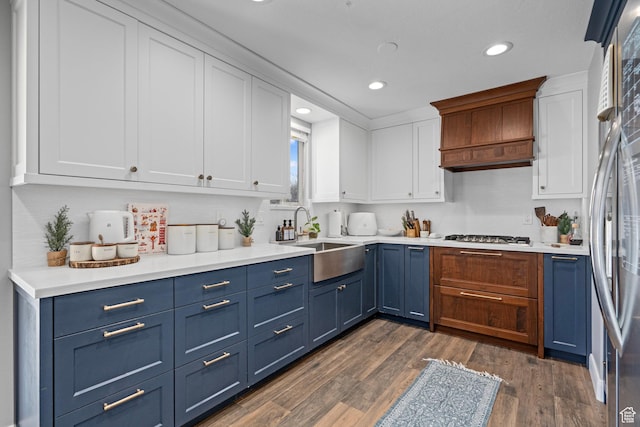 7935 S 2800 W, West Jordan, UT 84088 - kitchen with blue cabinetry, a sink, white cabinetry, recessed lighting, and light countertops