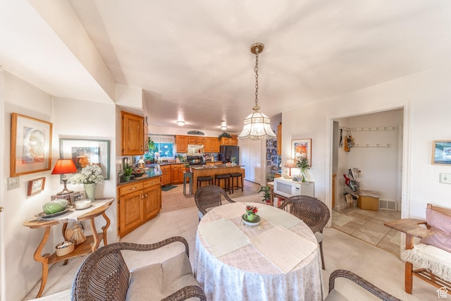 145 Deer Run Ln, Layton, UT 84040 - dining area with a chandelier and light carpet