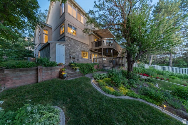145 Deer Run Ln, Layton, UT 84040 - back of house featuring stucco siding, stone siding, and a deck