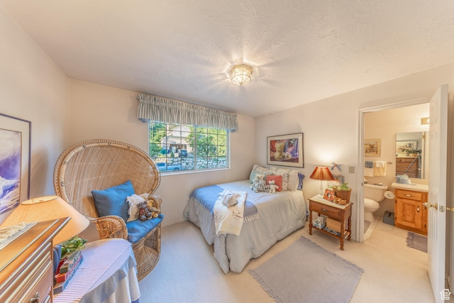 145 Deer Run Ln, Layton, UT 84040 - bedroom with light colored carpet, connected bathroom, and a textured ceiling