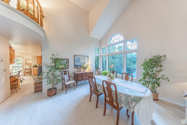 145 Deer Run Ln, Layton, UT 84040 - dining room featuring light colored carpet, high vaulted ceiling, and healthy amount of natural light