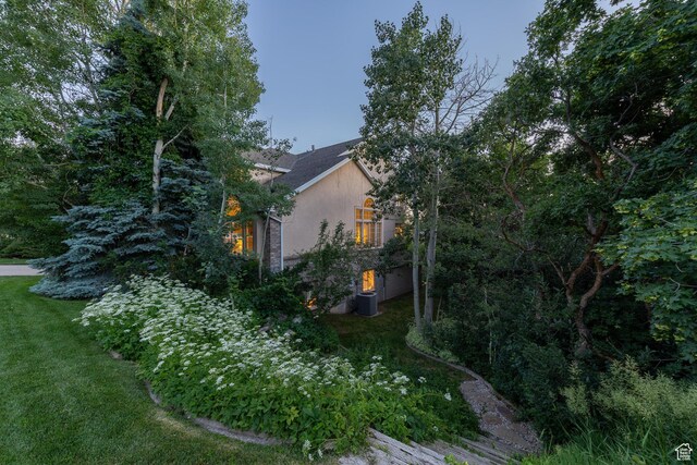 145 Deer Run Ln, Layton, UT 84040 - view of home's exterior featuring stucco siding and a yard