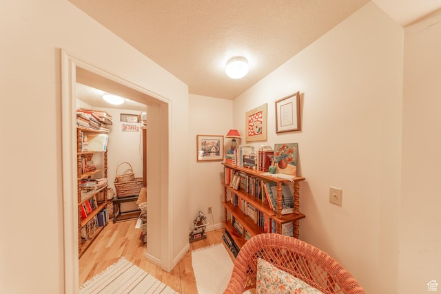 145 Deer Run Ln, Layton, UT 84040 - corridor featuring light wood finished floors, baseboards, and a textured ceiling