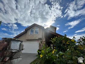 3013 N 100 W, Provo, UT 84604 - view of side of home featuring an attached garage and concrete driveway