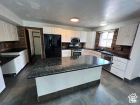3013 N 100 W, Provo, UT 84604 - kitchen with stainless steel appliances, a center island, white cabinetry, and a sink