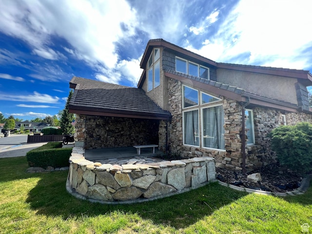 3013 N 100 W, Provo, UT 84604 - back of house with stone siding and a lawn