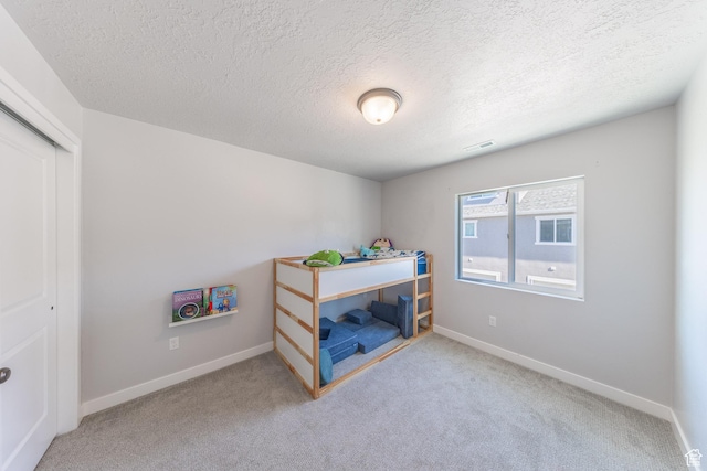 3333 W 3745th St S, West Haven, UT 84401 - bedroom featuring carpet flooring, a textured ceiling, and a closet